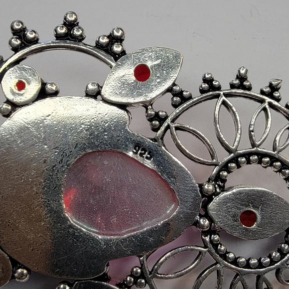 Sterling Silver Pendant with Pink Carved Face and Garnet Accents - Picture 10 of 10